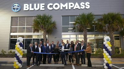 A picture of Blue Compass RV staff outside the Tampa RV One Superstores location as the store is rebranded to Blue Compass