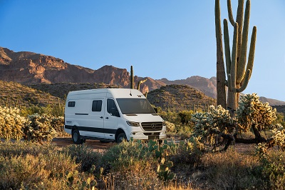 A picture of the 2023 Limited Edition Winnebago Adventure Wagon in the desert with a cactus in the foreground.