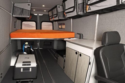 A picture of the Winnebago 2023 limited edition Adventure Wagon interior showing soft-sized storage and an orange mattress
