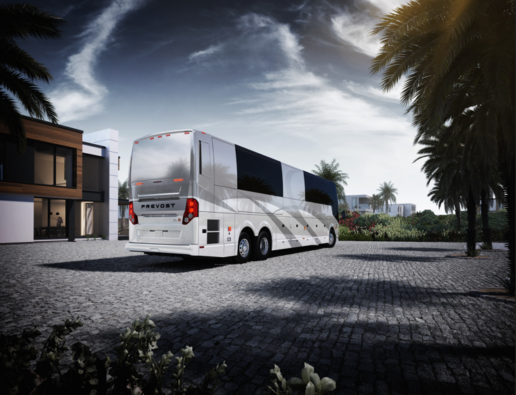 A picture of the back of the Prevost motorhiome H3_45 in a warm climate setting