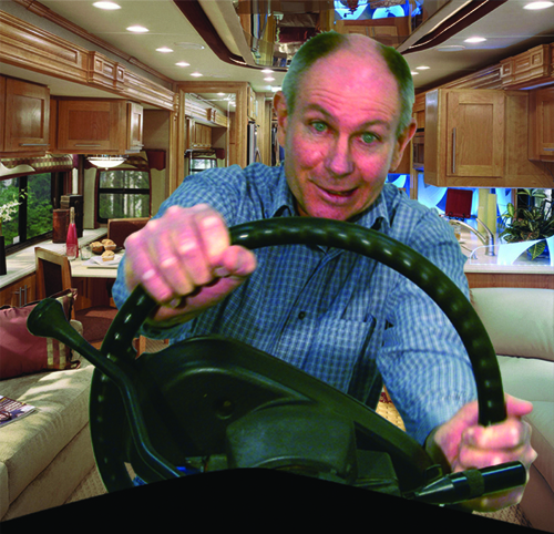 A picture of a man in a motorhome gripping for dear life onto his steering wheel