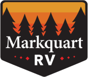 A picture of the Markquart RV Logo, a shield with an orange ombre background fronted by dark pine trees and the words Marquart RV in white