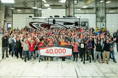 A picture of a group of employees at Rev Group marking the production of their 40,000th RV, a Fleetwood Bounder, to roll off the line