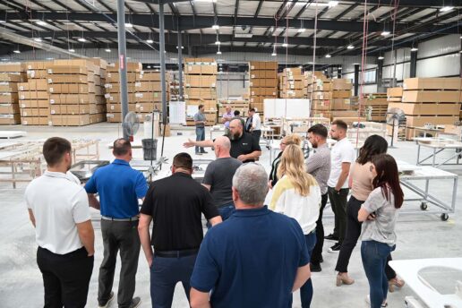 A picture of a group touring Genesis Plant 10 on opening day