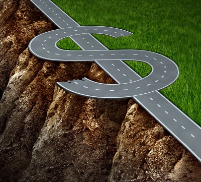 A picture of a dollar sign made into a road with one side ending in green pasture and the other side a treacherous cliff