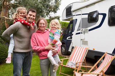A picture of a family of four RVing