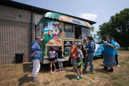 A picture of girls and boys getting shaved ice at RV Day in Middlebury Indiana in 2023.