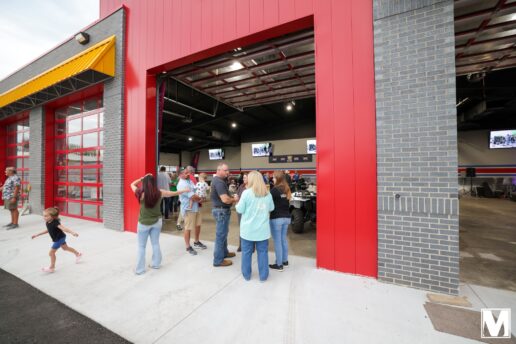 A picture of the Moix RV 2023 Service Building Grand Opening showing people touring the new facility.