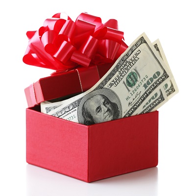 A picture of a cash donation gift in a bright red box with a lid topped with a multi-looped red bow.