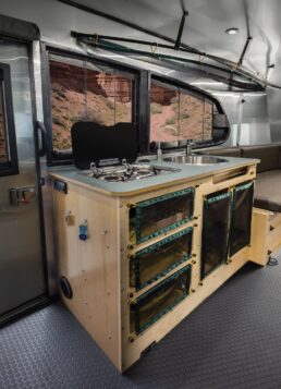 A picture of the galley of Airstream's Basecamp 20X, a 2024 collaboration with REI Co-Op.