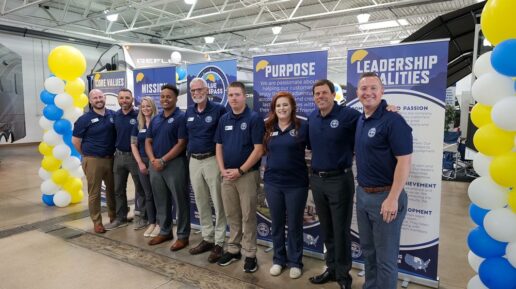 A picture of staff inside a Blue Compass RV store in Colorado after the store's rebranding.