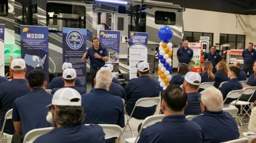 A picture of Blue Compass RV President and CEO Jon Ferrando leading a team meeting during a re-branding of one of the company's stores in Texas.