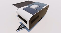 A picture of the exterior of the Coast electric RV travel trailer, with five solar panels on the roof.