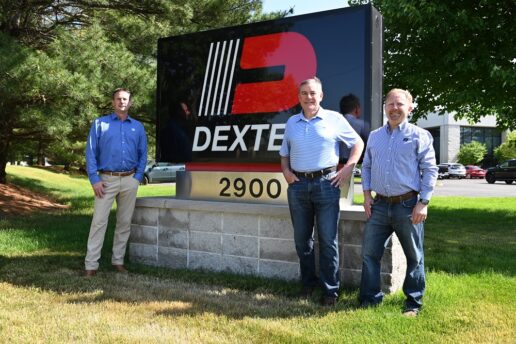 A picture of Dexter leadership standing in front of the company sign, including (L to R) Mark Nave, market manager; Adam Dexter, president and CEO; Bryan Thursby, chief commercial officer.