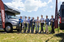 A picture of employees at the ground breaking ceremony for the General RV Center store in South Weber, Utah.