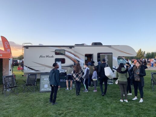 A picture of consumers gathered outside a Four Winds Type C motorhome in Reno, Nevada, at a 2021 Go RVing experiential event.