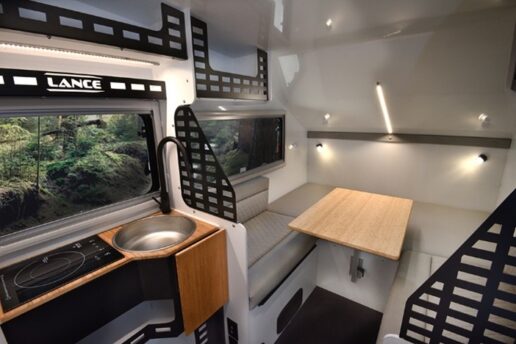 A picture of the interior and kitchen galley of a 2023 Lance Camper Enduro off-road travel trailer.