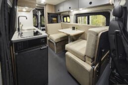 A picture of the interior of the 2024 Solis Pocket 36B, focused on the multi-functional dinette on the right of the picture.