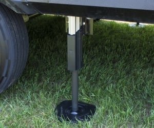 A picture of Lippert's Titan hydraulic leveler on the ground.