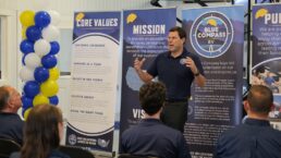 A picture of Blue Compass RV President and CEO Jon Ferrando addressing employees during a brand rollout event in the Northeast.
