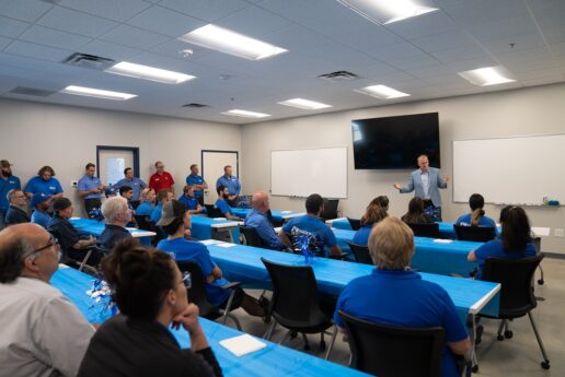 A picture of Entegra Coach President and CEO Ken Walters addressing the National Indoor RV Centers team in Georgia.