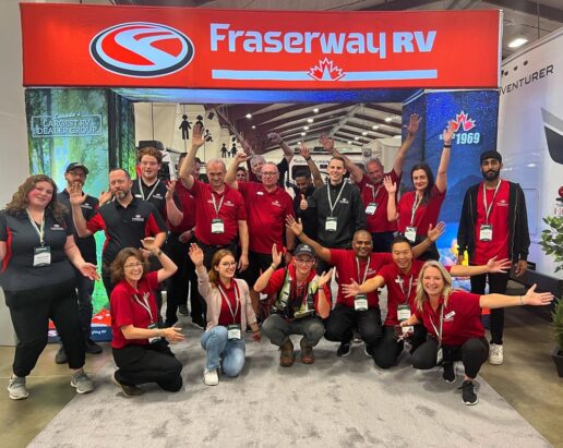 A picture of the employees at Fraserway RV waving goodbye to attendees leaving the Snowbird RV Show in September 2023.