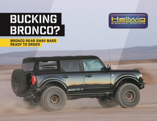 A picture of a Ford Bronco driving across a dirt road with Hellwig Suspension Products' logo in the upper right hand corner.