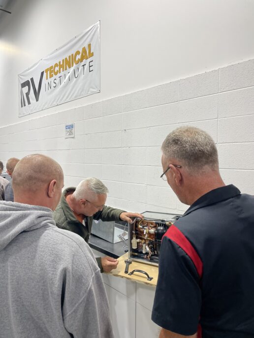 A picture of technicians being trained at the RVTI Institute in Elkhart, Indiana, on Truma's AquaGo water heater.