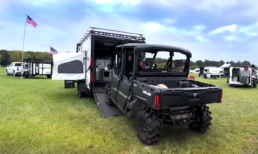 A picture of a side-by-side UTV loading into Encore RV's new toy hauler.