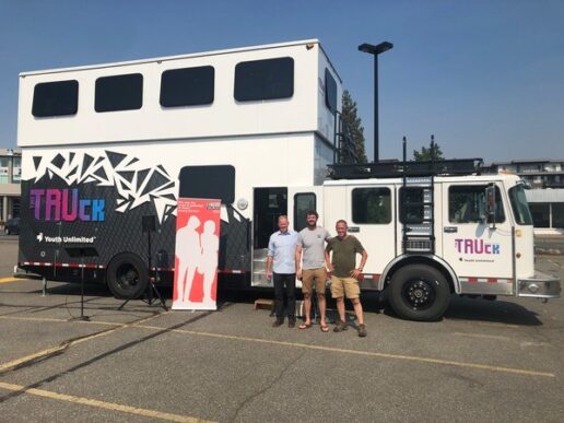 A picture of From left:  Mark Koop, Executive Director of Greater Vancouver Youth Unlimited; Ken Neufeld, Area Director; Chris Hyslop, Youth Worker; and all standing in front of their most recent mobile drop-in project "The Truck."