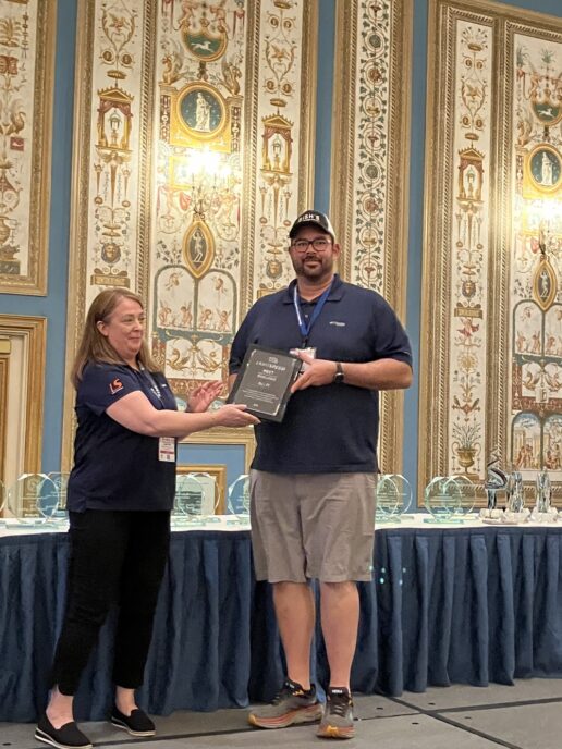 A picture of Lightspeed presenting an RECT award to Bish's RV during the 2023 RVDA Convention/Expo.