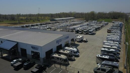 An aerial photo of RVs lined up on the dealership lot of RCD RV.