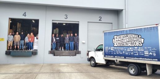 A picture of Laurelhurst staff standing in the headquarters' shipping bays in Portland, Oregon.
