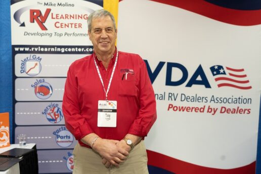 A picture of Tony Yerman standing at an RVDA booth.
