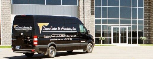 A picture of a Dave Carter & Associates van parked outside a building.