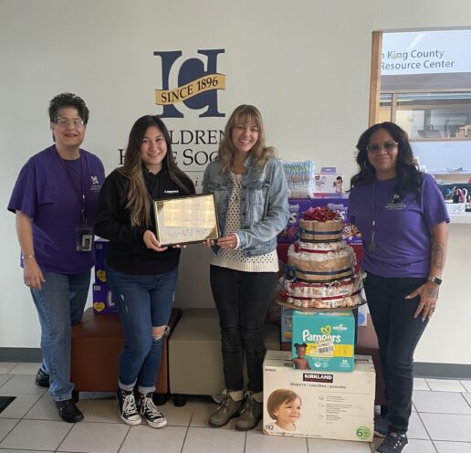 A picture of Torklift Central team member promoting "March of Diapers" campaign.