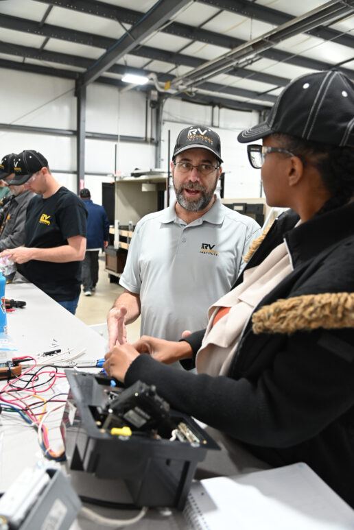 (Left to right) Chris Jachim, a Level 4 Instructor and master technician, helps Level 2 trainee Shantell Witter during electrical lab training at the RV Technical Institute.