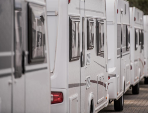 A generic photo of several RVs lined up.
