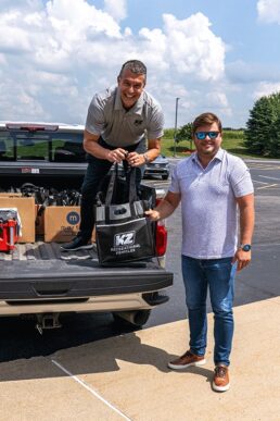 A photo of KZ RV President Ryan Juday dropping off donated school supplies.