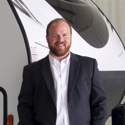 A photo of Apex's Max Keagle in front of an RV.