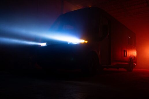 A vague exterior photo of the RVEX exterior with the headlights on.