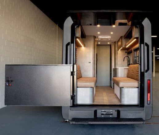 A photo of the open rear door on the RVEX and the interior of the motorhome.