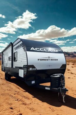 A photo of the exterior of an Acclaim travel trailer from East to West RV.