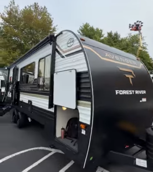A screenshot of the Prime Time RV Avenger travel trailer.