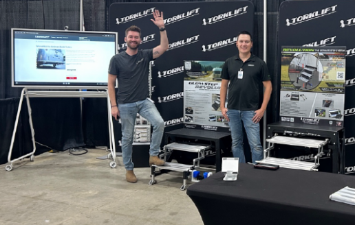 A photo of two members of Torklift International's sales team at an Airstream rally.