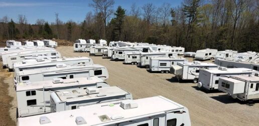A photo of used RVs on a lot.