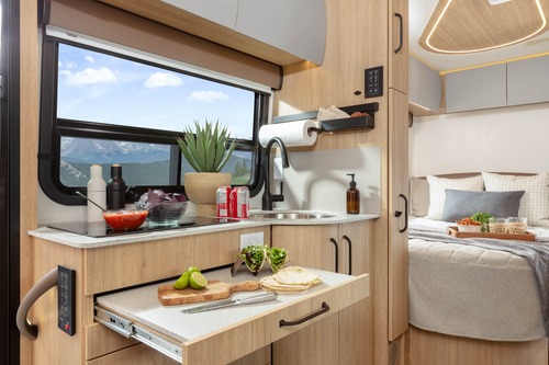 A photo showing the interior of a Leisure Travel Vans Desert Shadow Edition