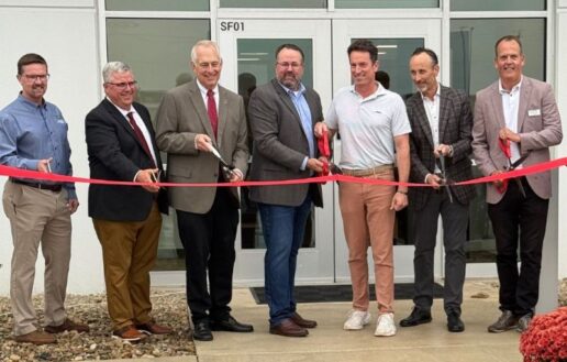 A photo of Lippert CEO Jason Lippert and South Bend, Indiana, community leaders cutting the ribbon at the company's new distribution center.