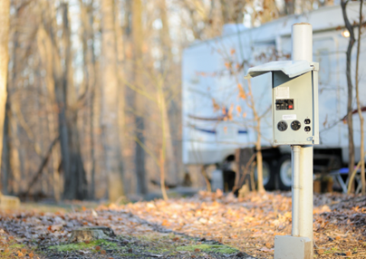 A photo of an electrical hookup at an RV campground.