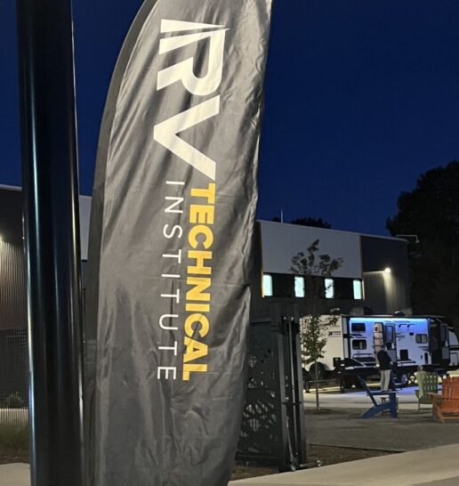 A photo of the RV Technical Institute banner with an RV in the background at Littleton, Colorado's EPIC Campus.